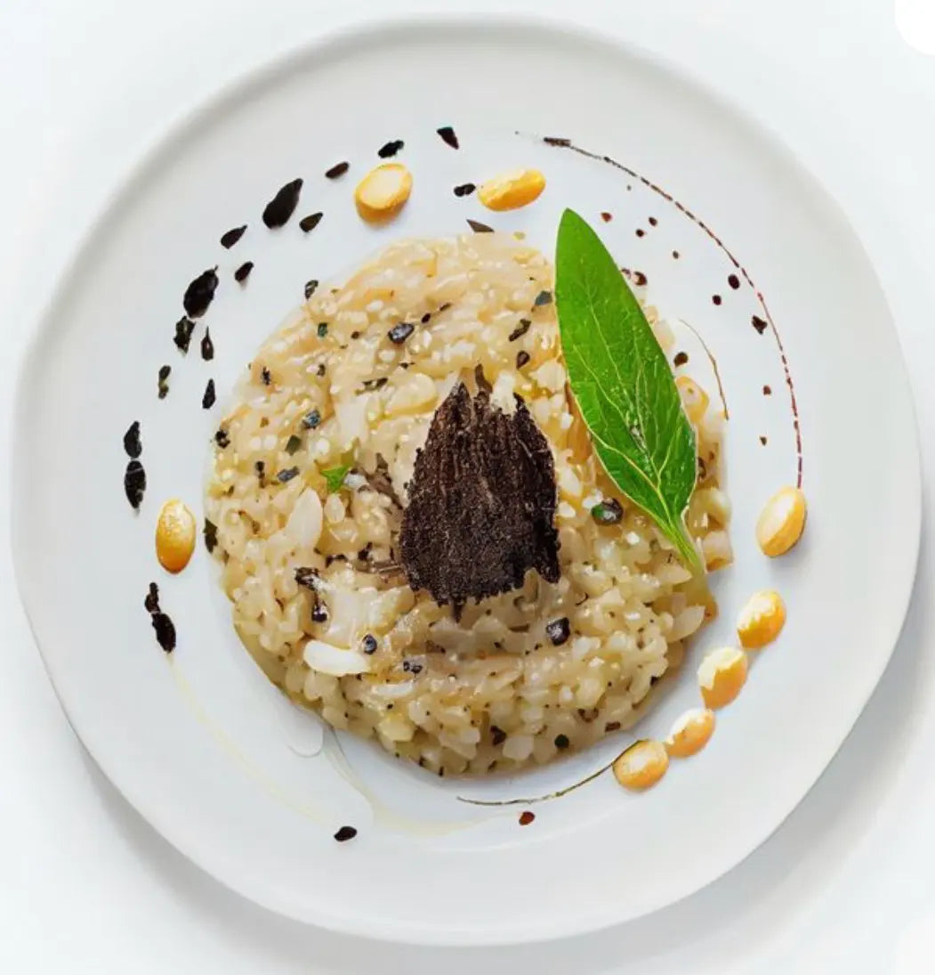 Black truffle risotto with shaved truffle and olive oil, plated in fine dining style on white plate