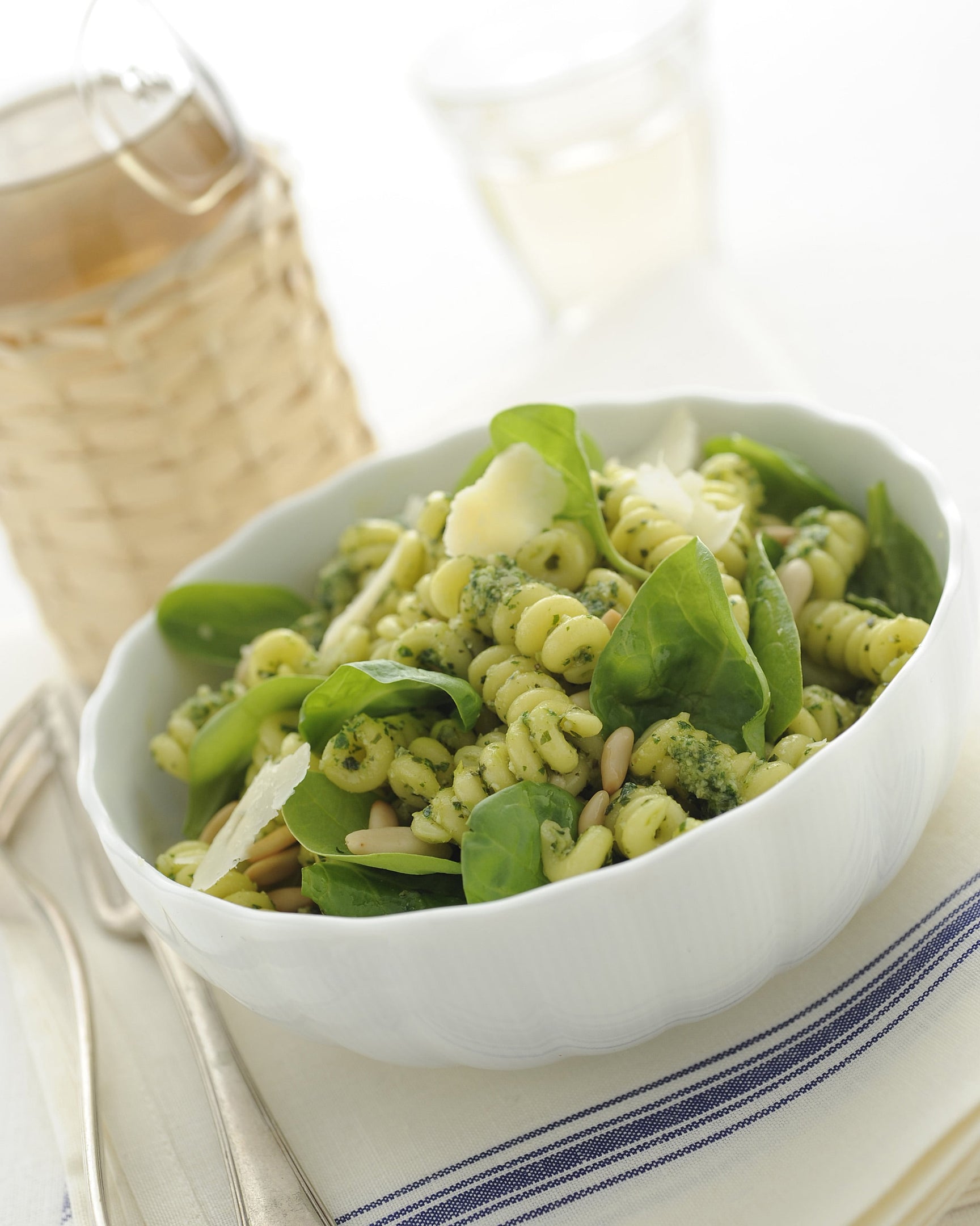 Italian cold pasta with herb sauce, toasted pine nuts, baby spinach, and Parmigiano Reggiano shavings, finished with extra virgin olive oil.