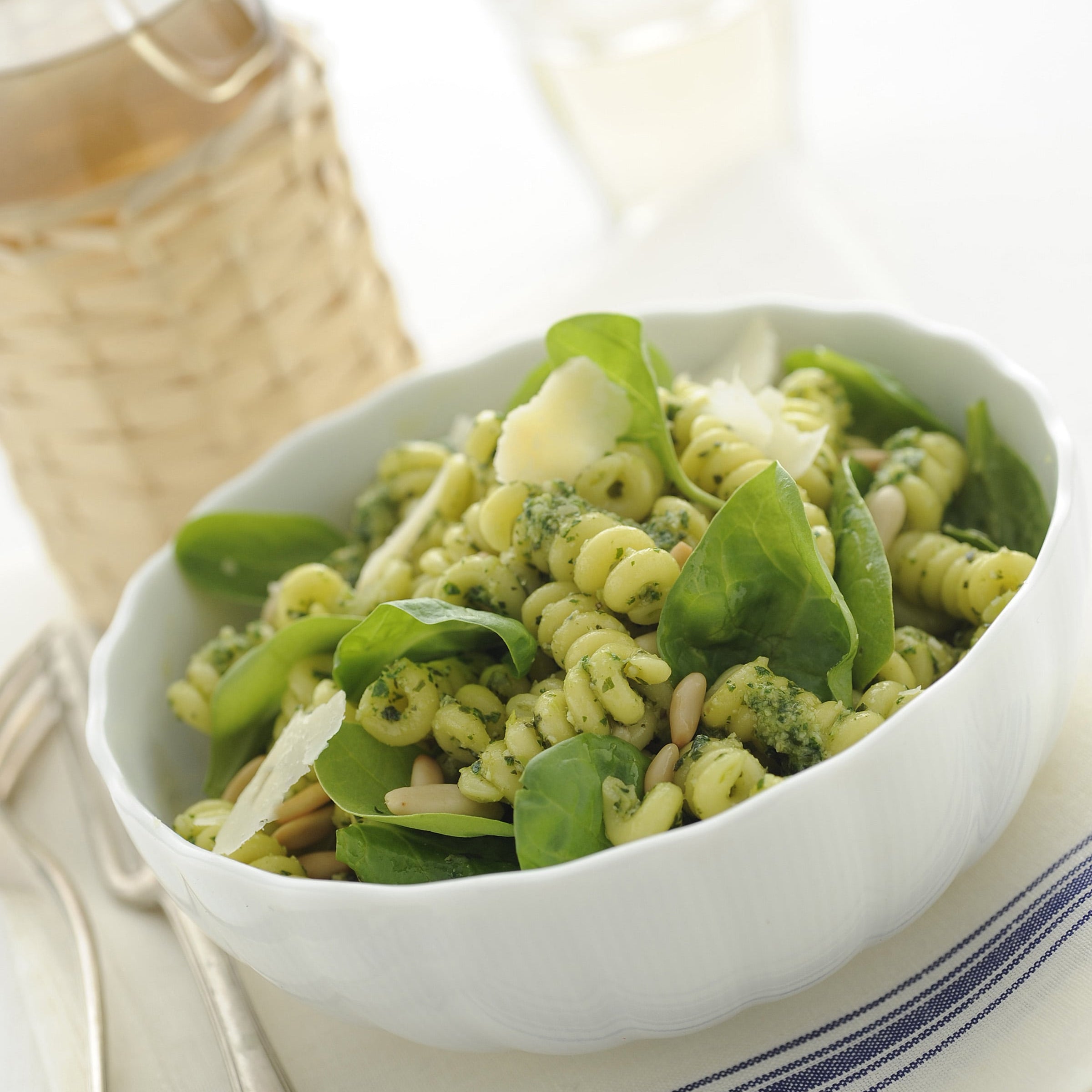 Italian cold pasta with herb sauce, toasted pine nuts, baby spinach, and Parmigiano Reggiano shavings, finished with extra virgin olive oil.