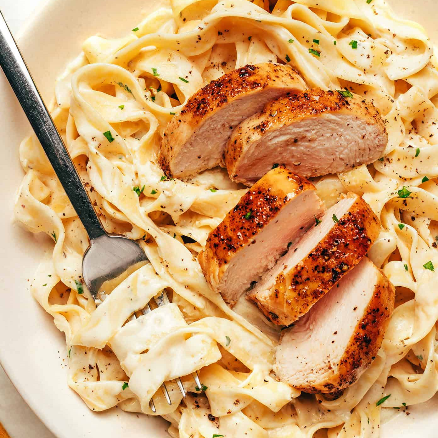 Authentic Fettuccine Alfredo made with fresh fettuccine, butter, Parmigiano Reggiano, and starchy pasta water.