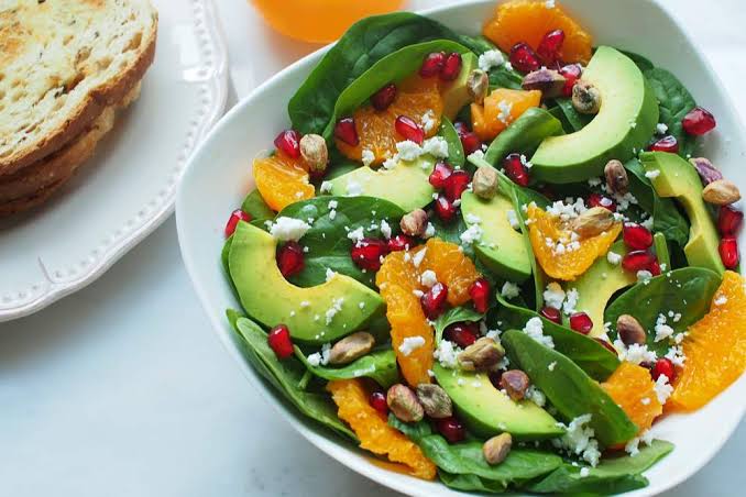 Salad dressed with extra virgin olive oil