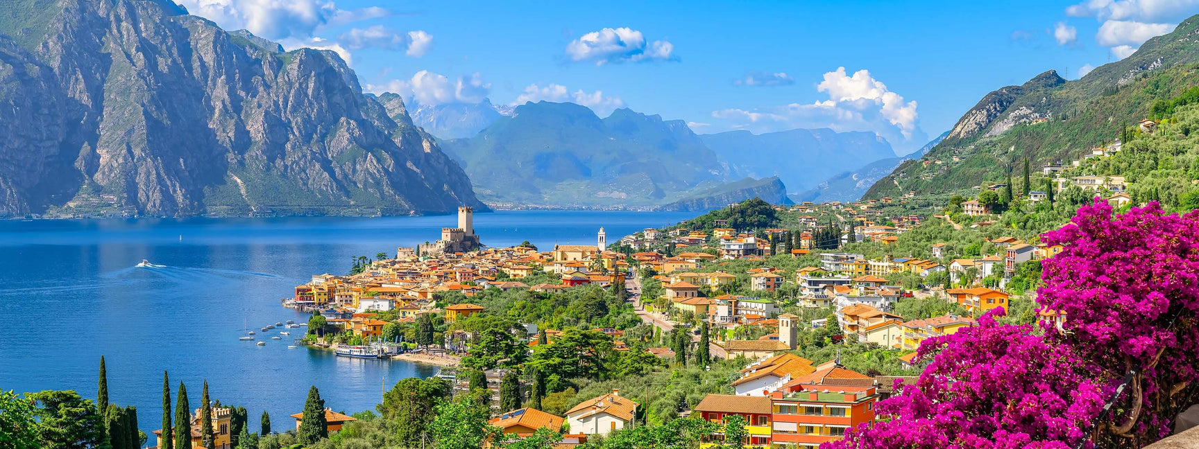 Two fresh truffles on a black reflective surface against a dark background