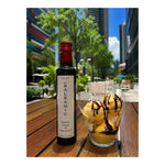 Milan Balsamic Vinegar of Modena IGP served with vanilla gelato and balsamic drizzle.