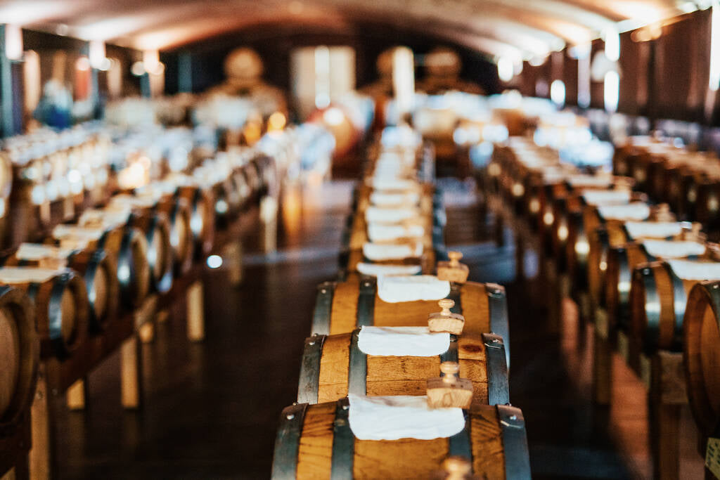 Wooden barrels used for aging balsamic vinegar in Modena, Italy.