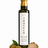 Milan Truffle White Truffle Infused Extra Virgin Olive Oil, styled with whole green olives, a green olive leaf, and a slice of white truffle on a clean white background.